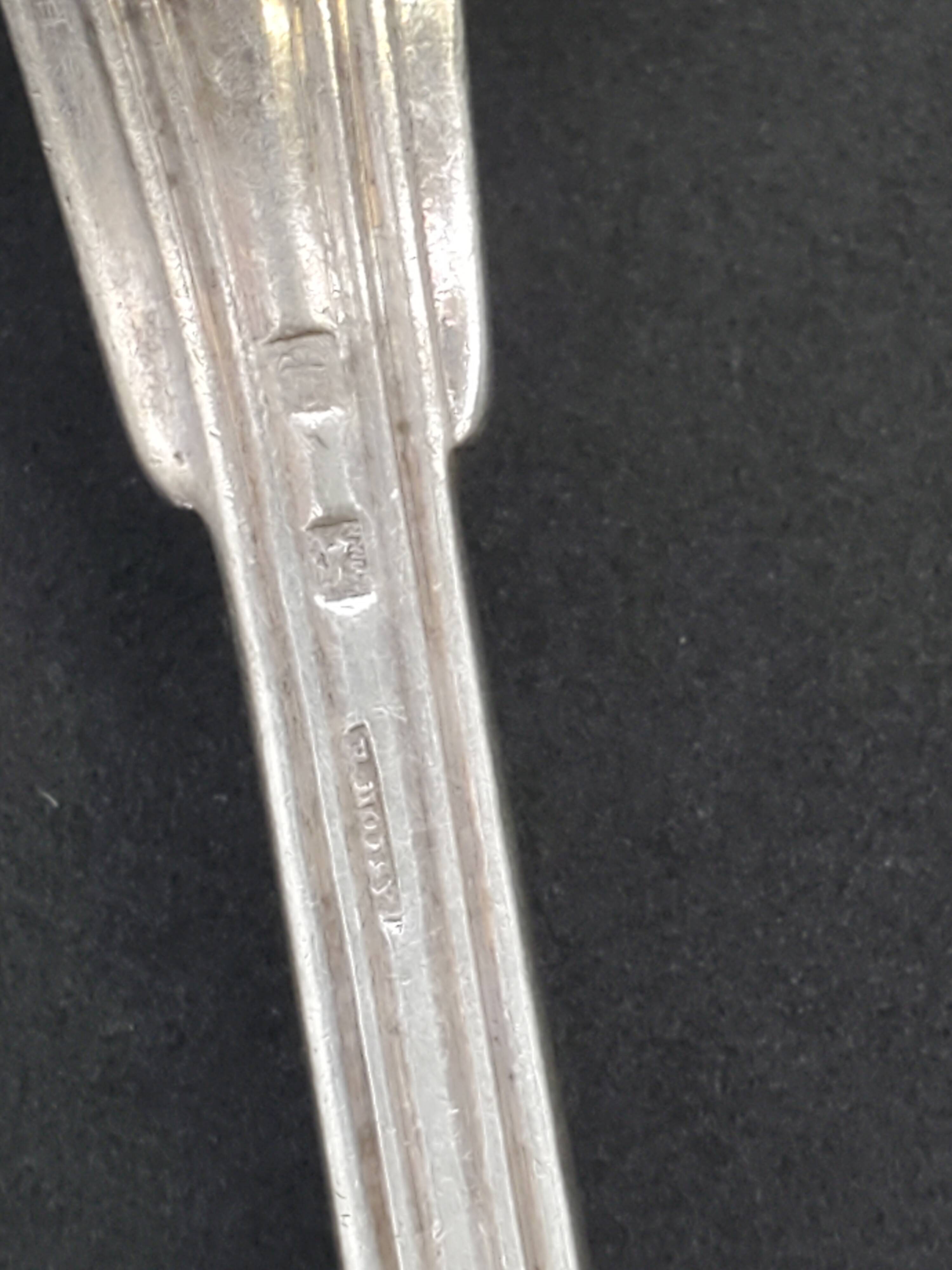 Set of 7 silver-plated dessert spoons with a bi-lobed filet pattern.