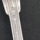 Set of 7 silver-plated dessert spoons with a bi-lobed filet pattern.