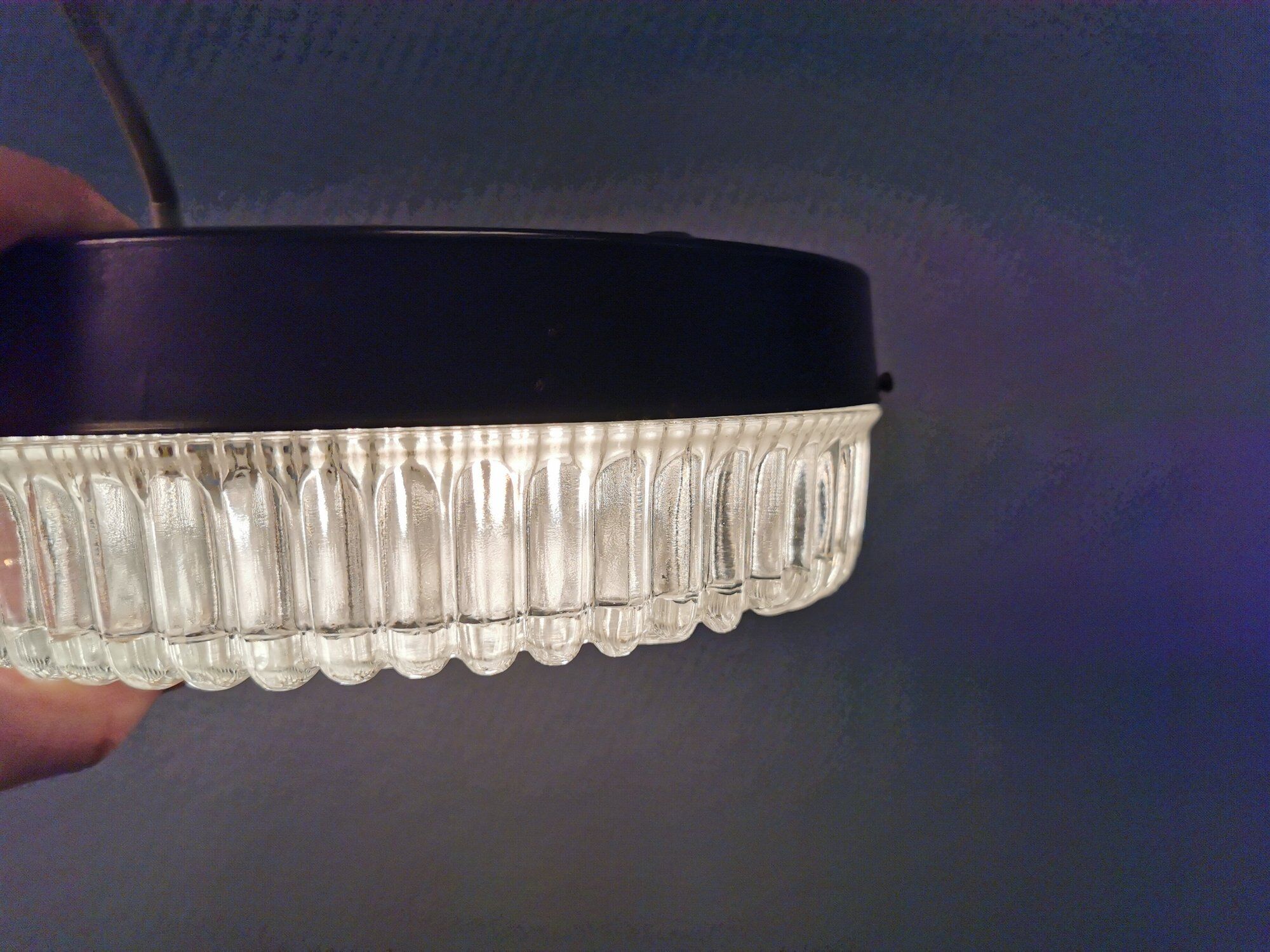 Ceiling light, in dark metallic paint with thick glass shade with beautiful details in the glass.
