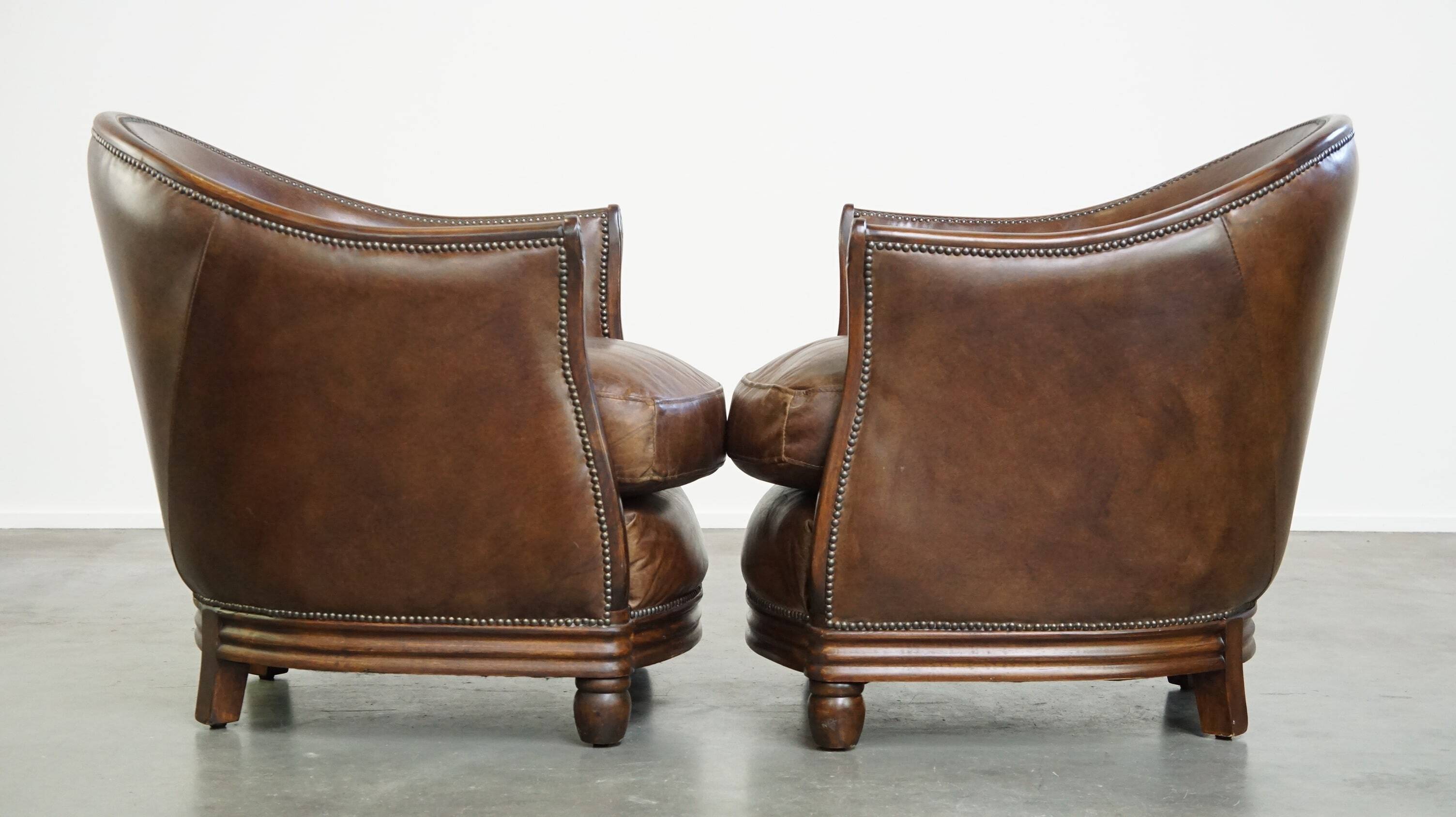 Set of 2 club chairs/armchairs in dark cognac leather