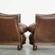 Set of 2 club chairs/armchairs in dark cognac leather