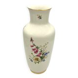 Porcelain flower vase with Digitalis purpurea L.
