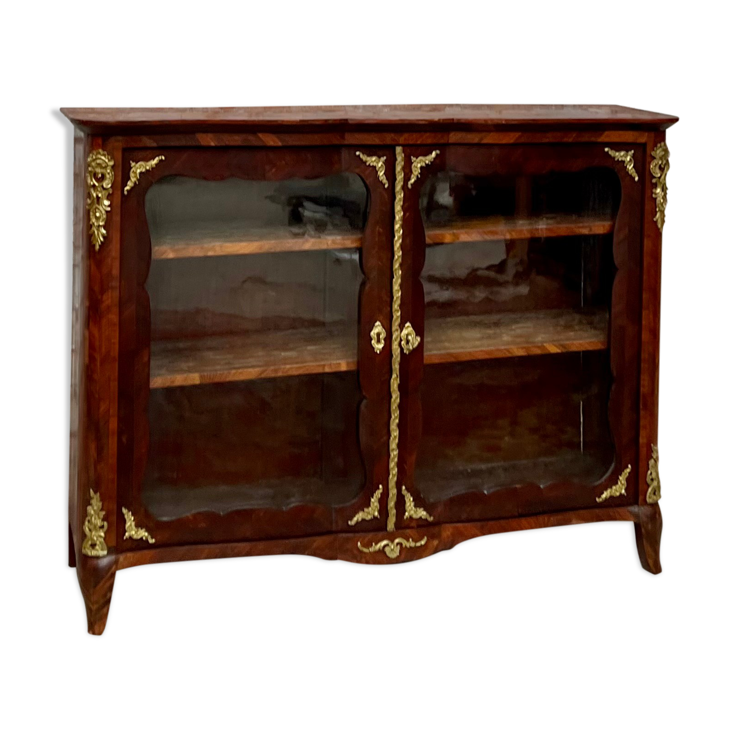 Low showcase in rosewood veneer of the regency xviii th century