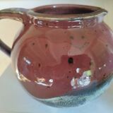 Stoneware pitcher by Matthieu Liévois in shades of red