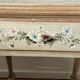 exotic wood console with a drawer