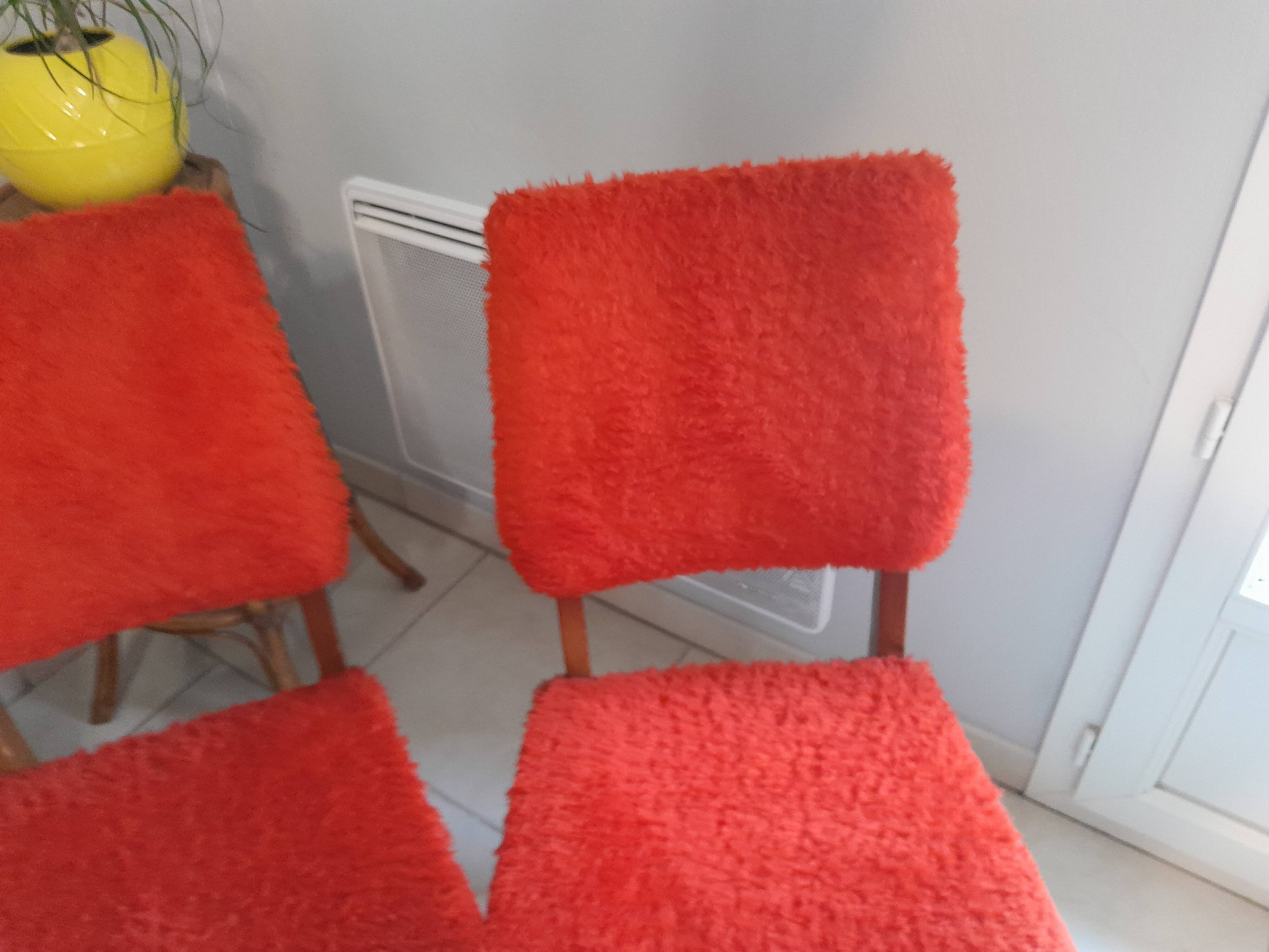 Pair of vintage red moumoute chairs with compass legs