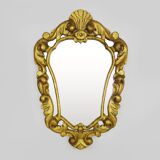 Old wall mirror in wood and gilded stucco with shell decoration, Louis XV style pediment mirror