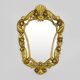 Old wall mirror in wood and gilded stucco with shell decoration, Louis XV style pediment mirror