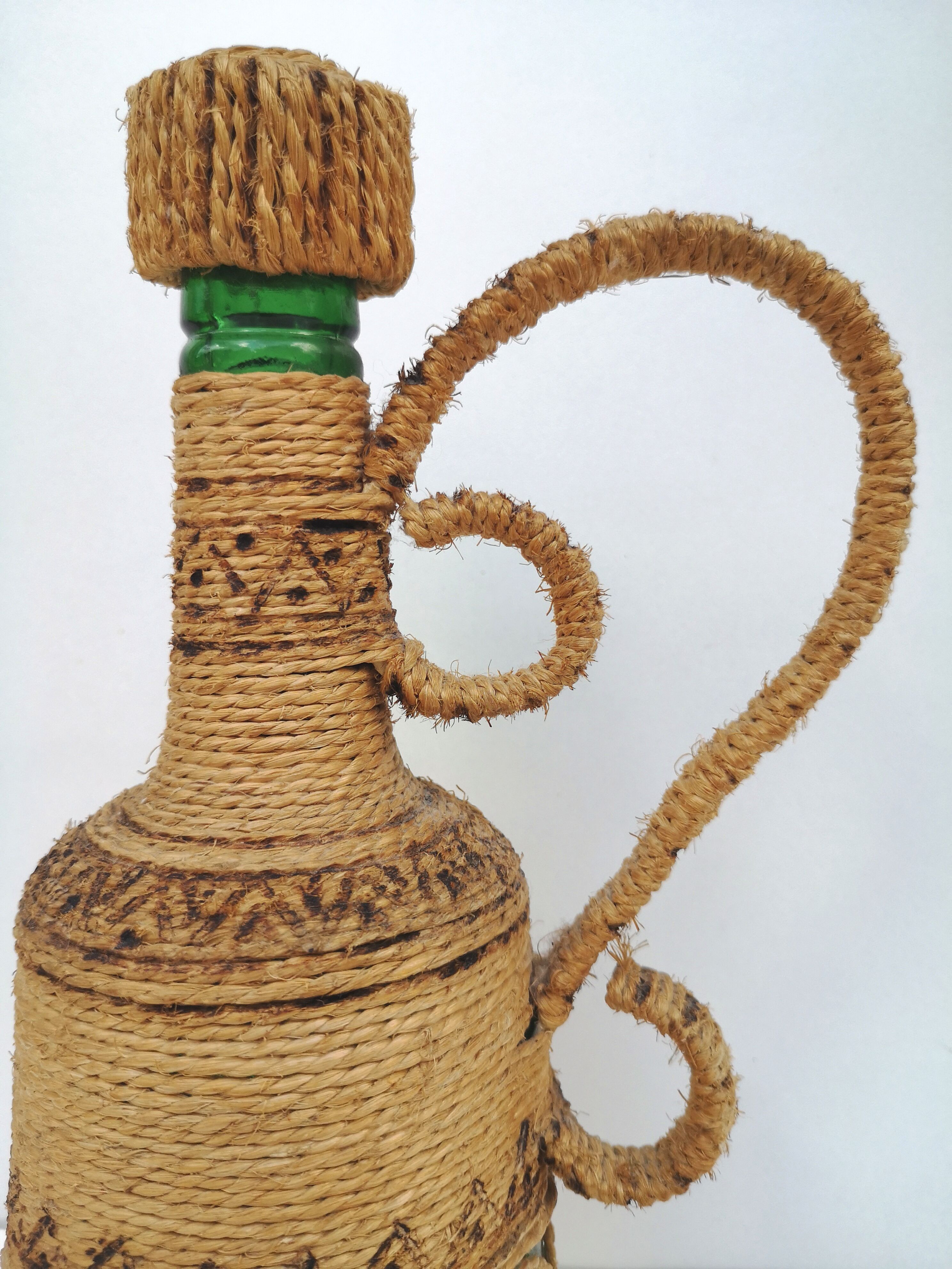 Vintage decorative rope bottle