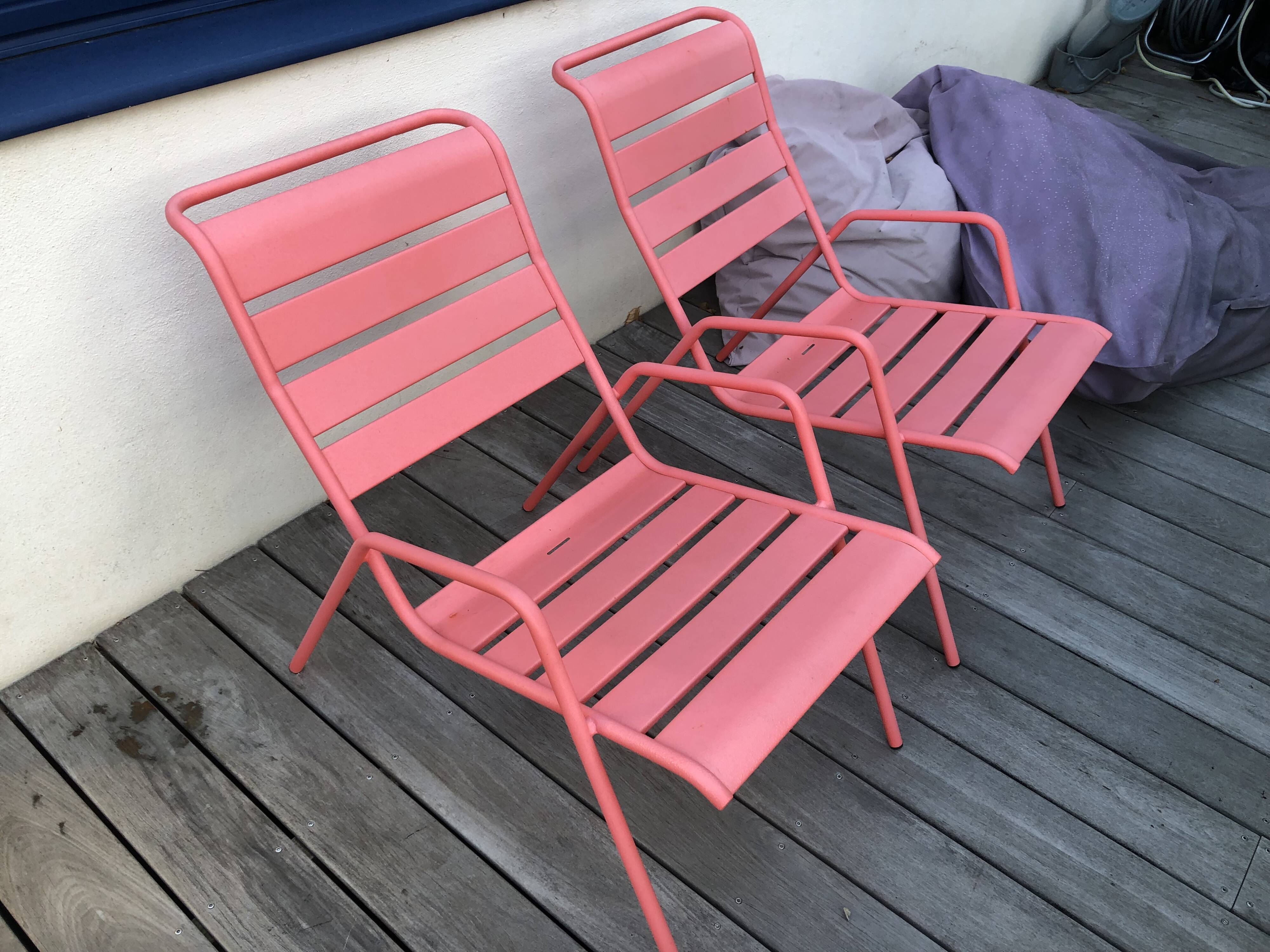 2 low chairs Fermob model Monceau in capucine colour.
