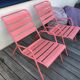 2 low chairs Fermob model Monceau in capucine colour.