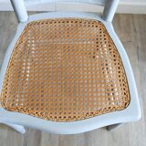 Low chair in wood and canework
