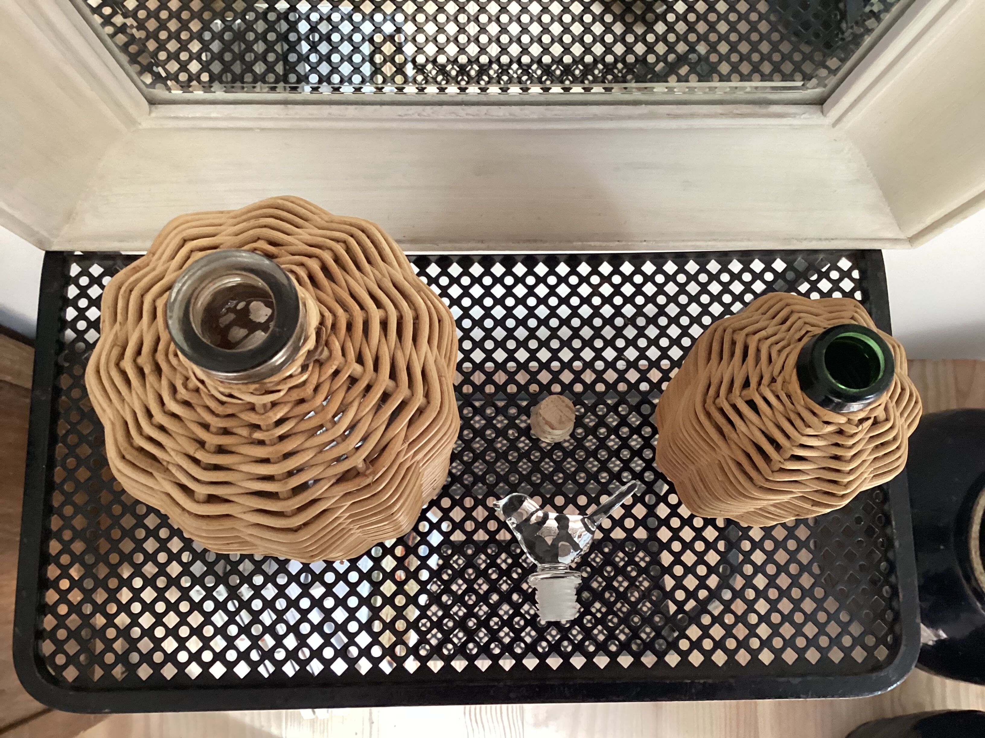 2 glass and rattan bottles