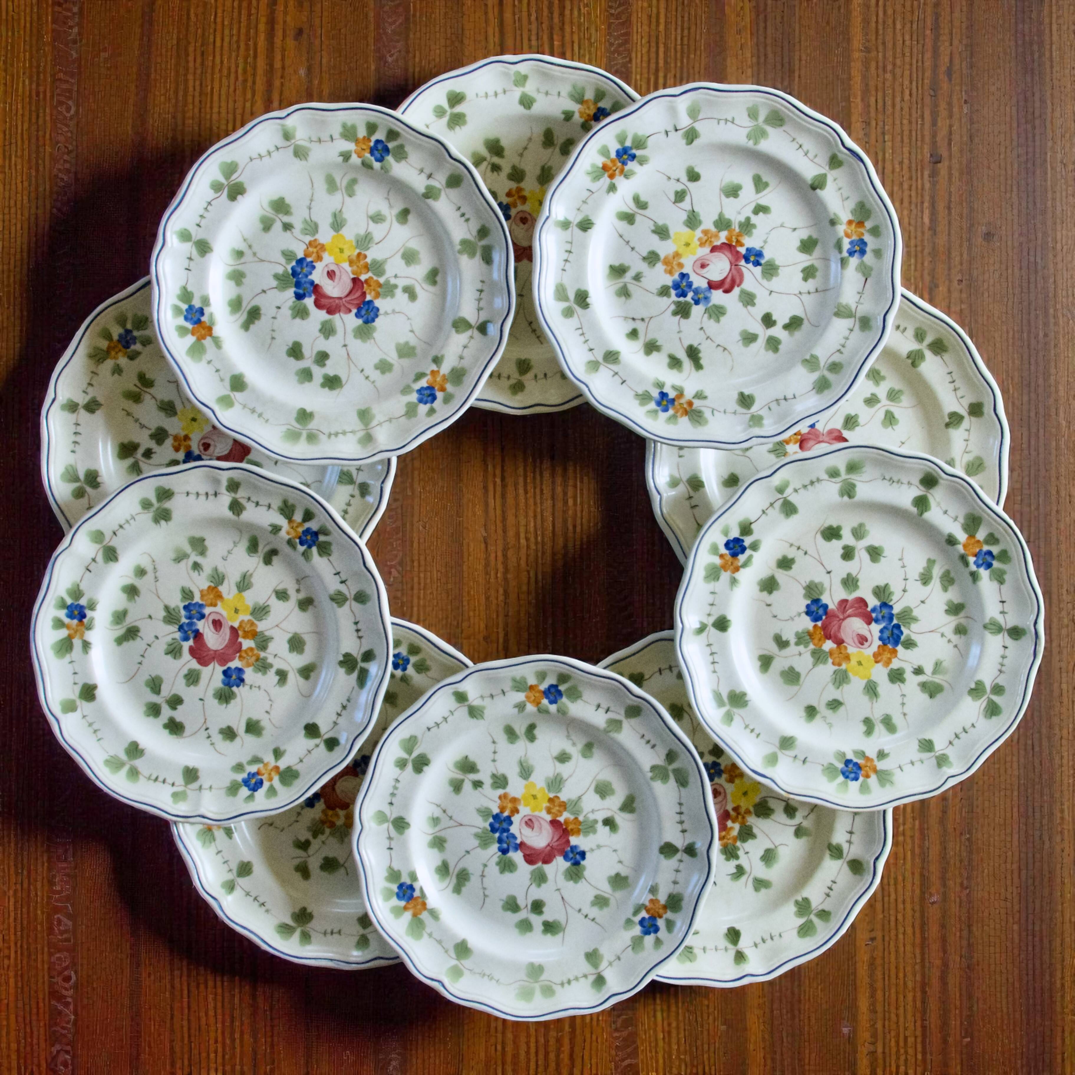 10 flat plates from the Longchamp "Nemours" collection, hand-painted.
