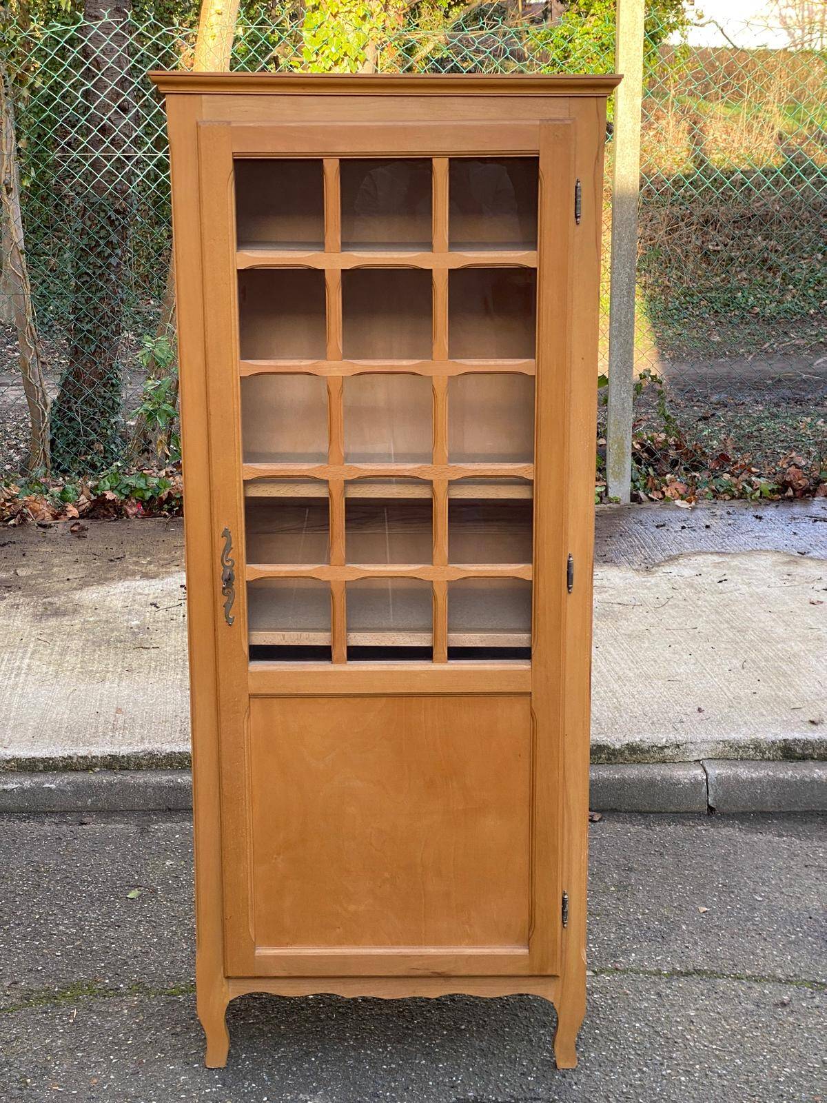 Parisian glass-fronted wardrobe in light wood from the 1960s.