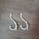 set of 2 vintage white cast iron hooks, small paint chips from the year