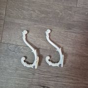 set of 2 vintage white cast iron hooks, small paint chips from the year
