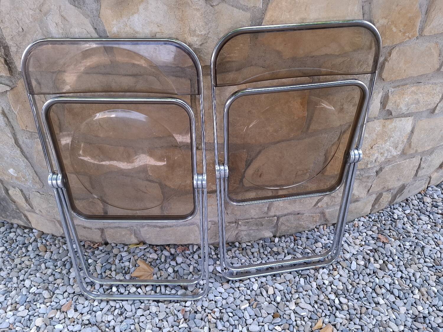 2 folding chairs designed by Giancarlo Piretti for Castelli