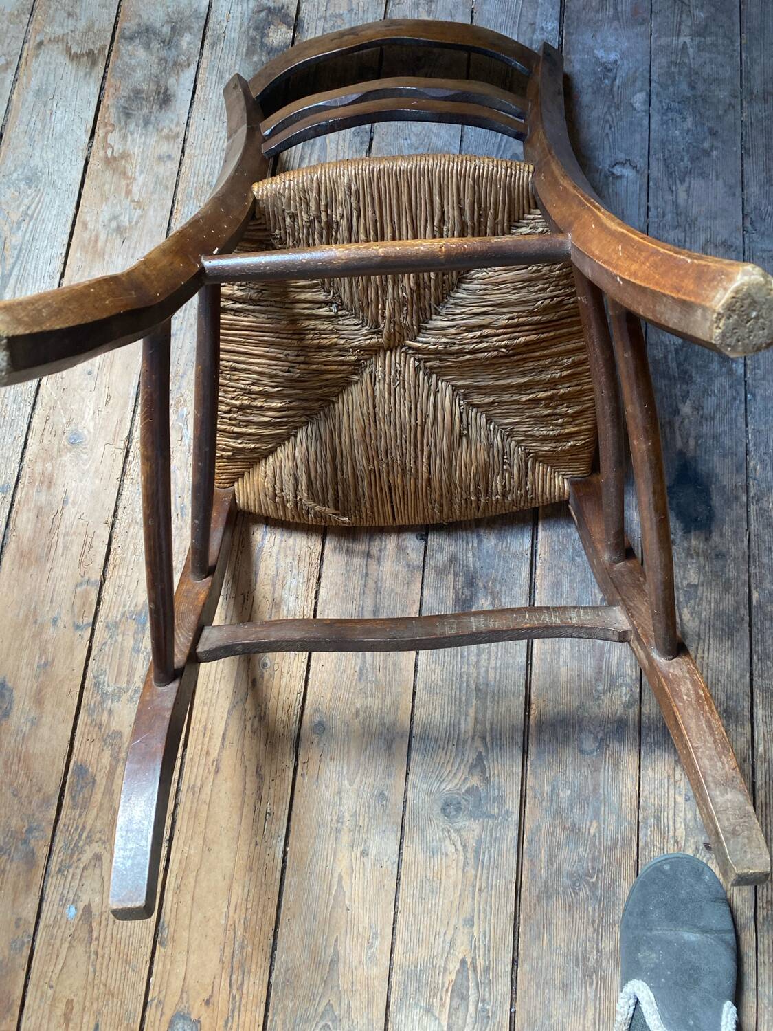 2 wooden chairs with cane