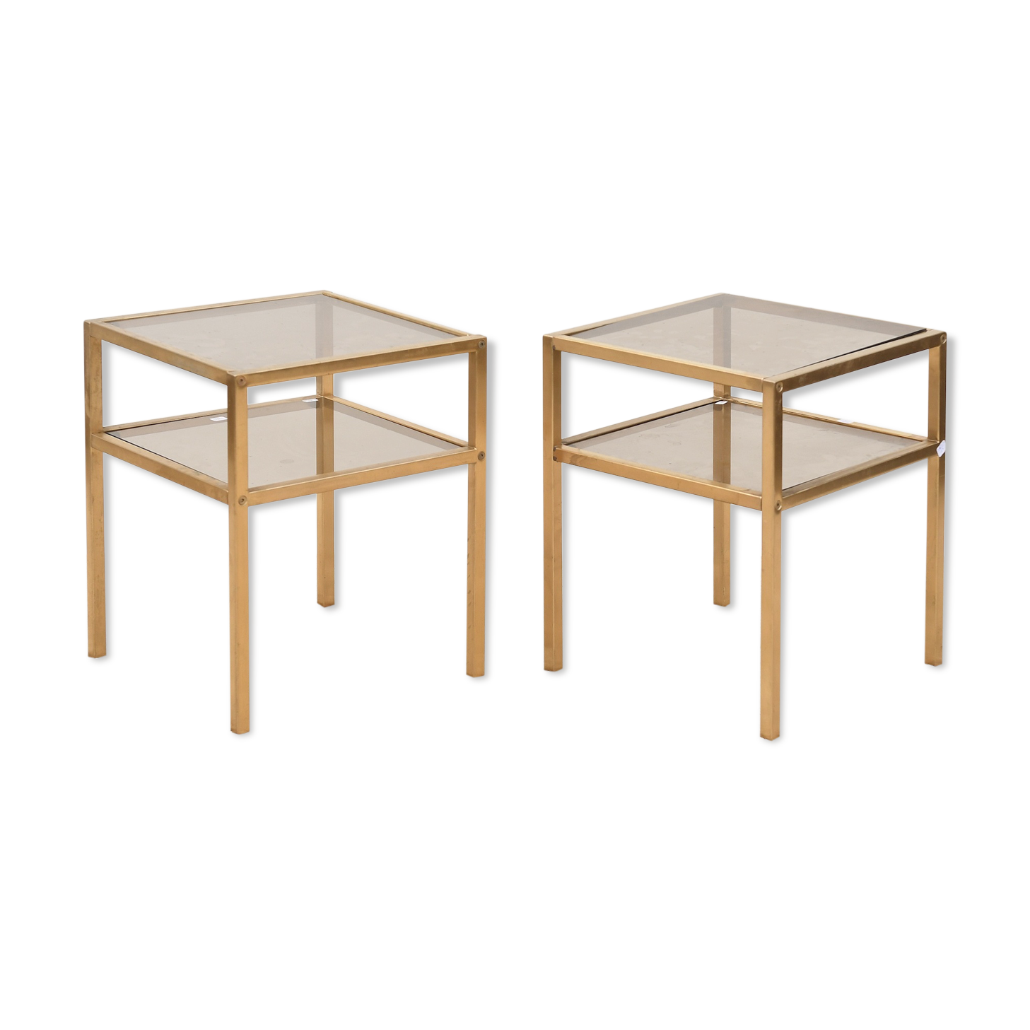 Deux bouts de canapé en verre et laiton