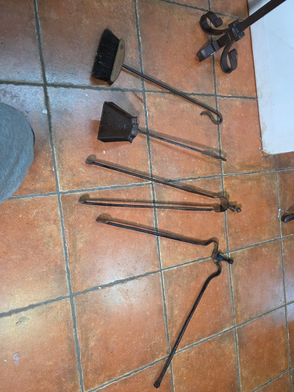 Antique fireplace set in solid wrought iron and brass.