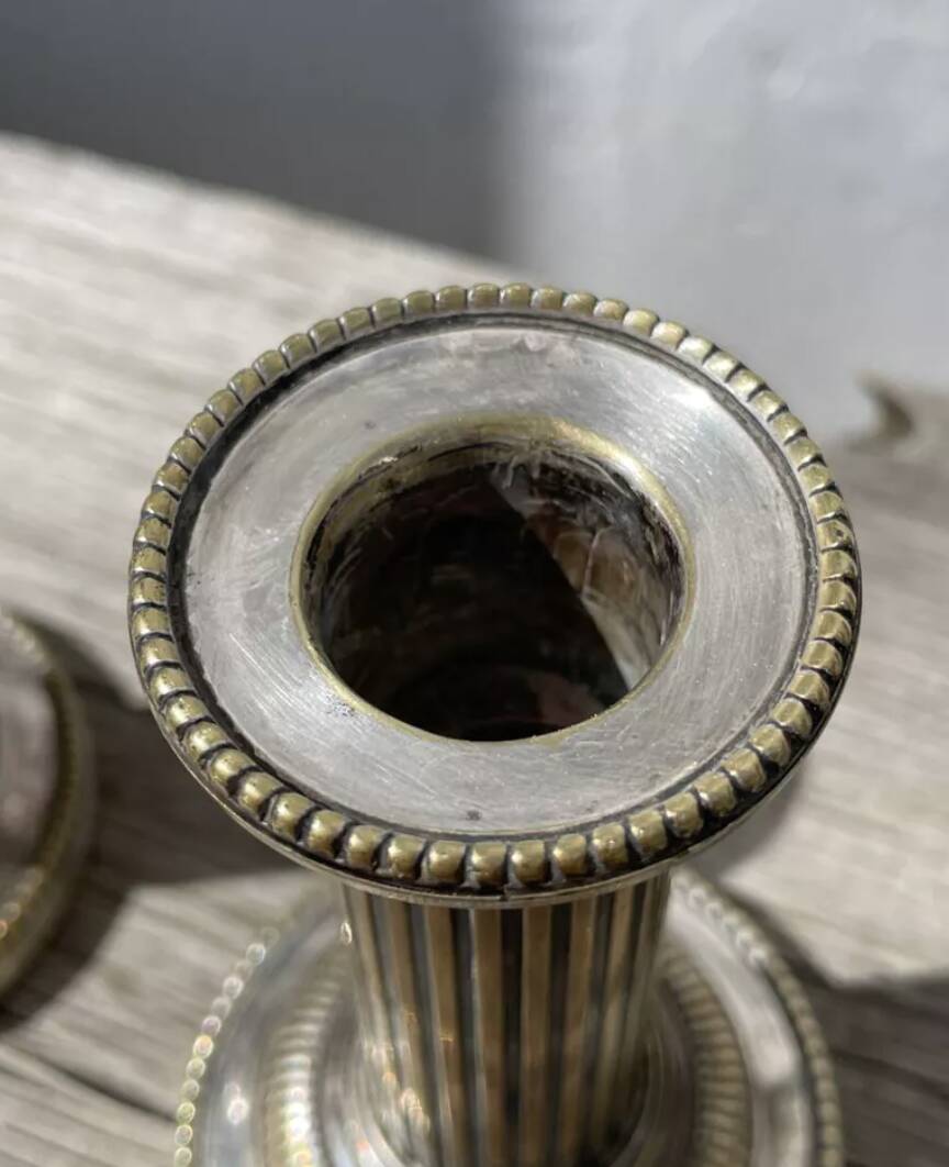 Pair of 19th-century fluted silver-plated metal candlesticks
