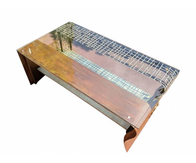Metal coffee table with a glass top.