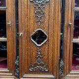 Antique rococo sideboard with integrated clock.