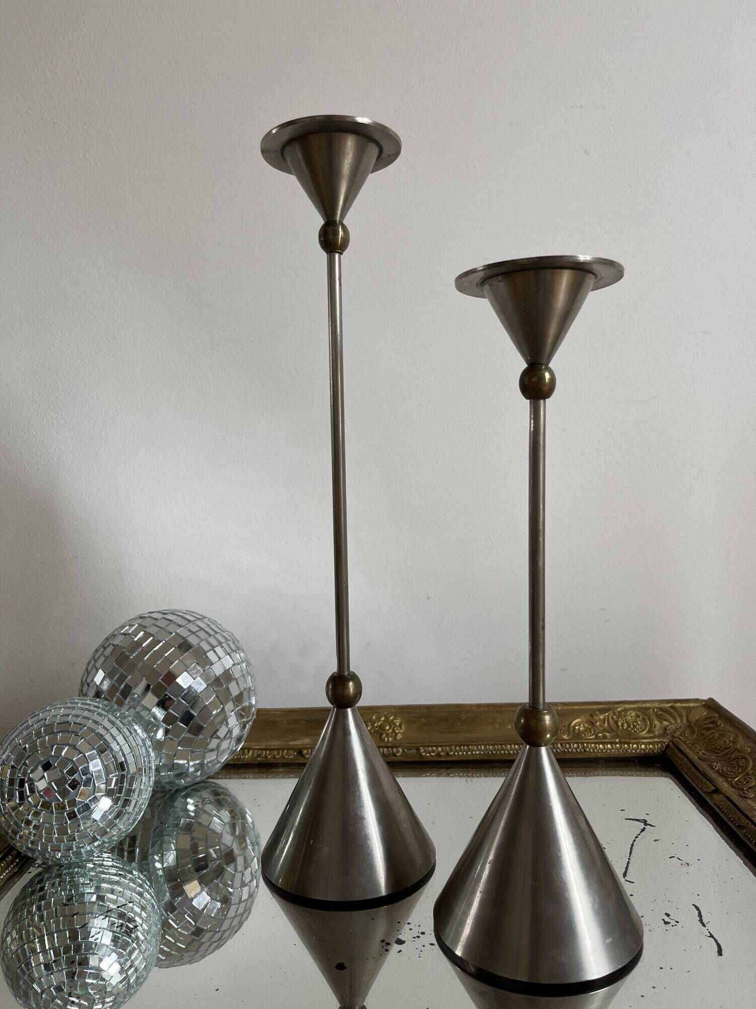 Pair of high vintage metal and brass candlesticks