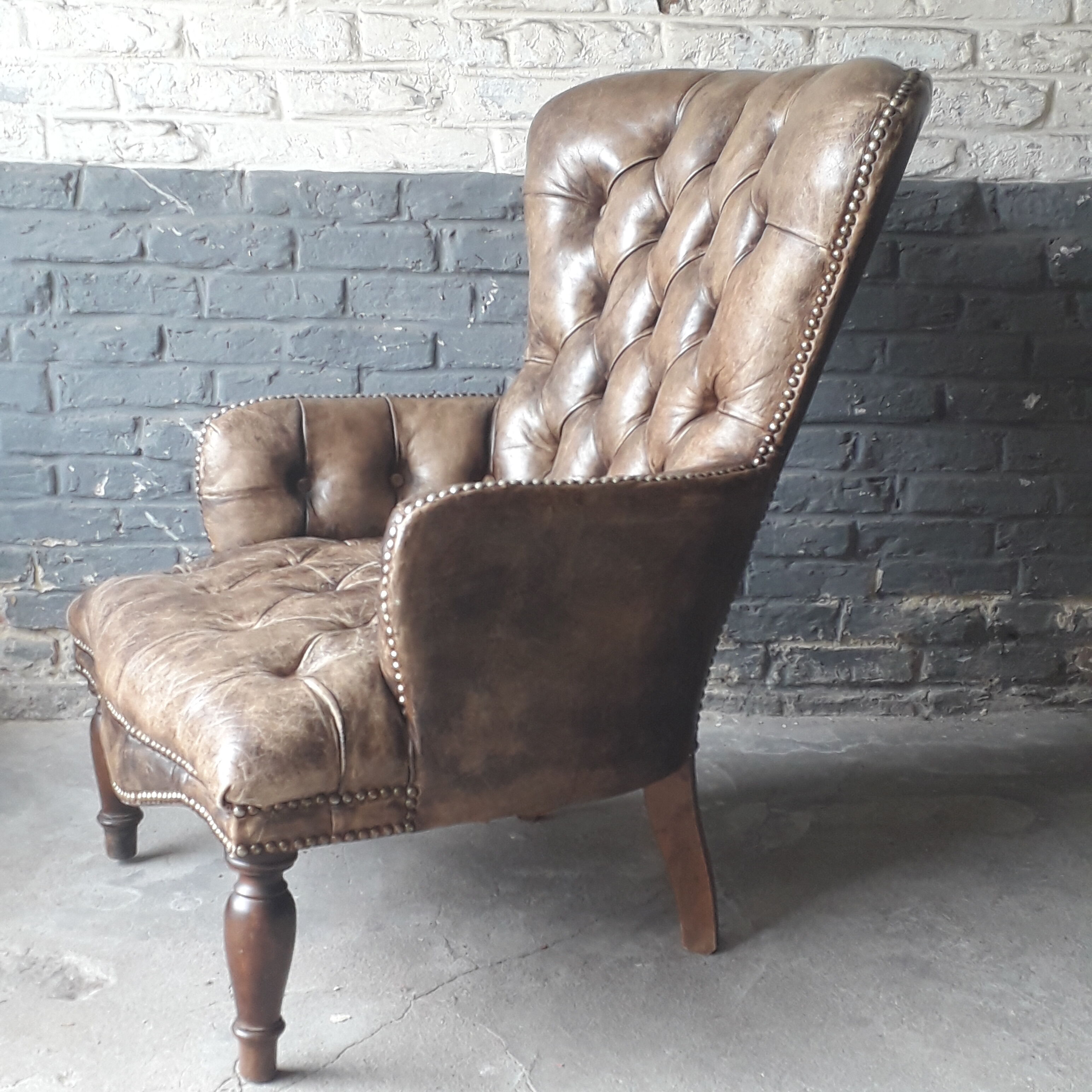 Fauteuil Chesterfield antique