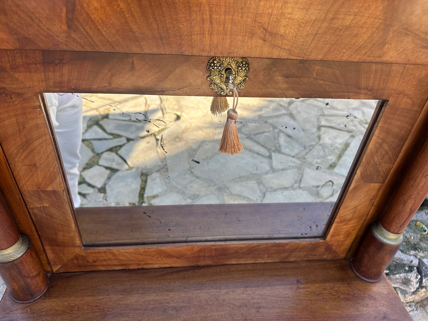 A small piece of Bonheur du jour with detached columns in Empire-era mahogany.