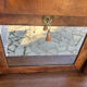 A small piece of Bonheur du jour with detached columns in Empire-era mahogany.