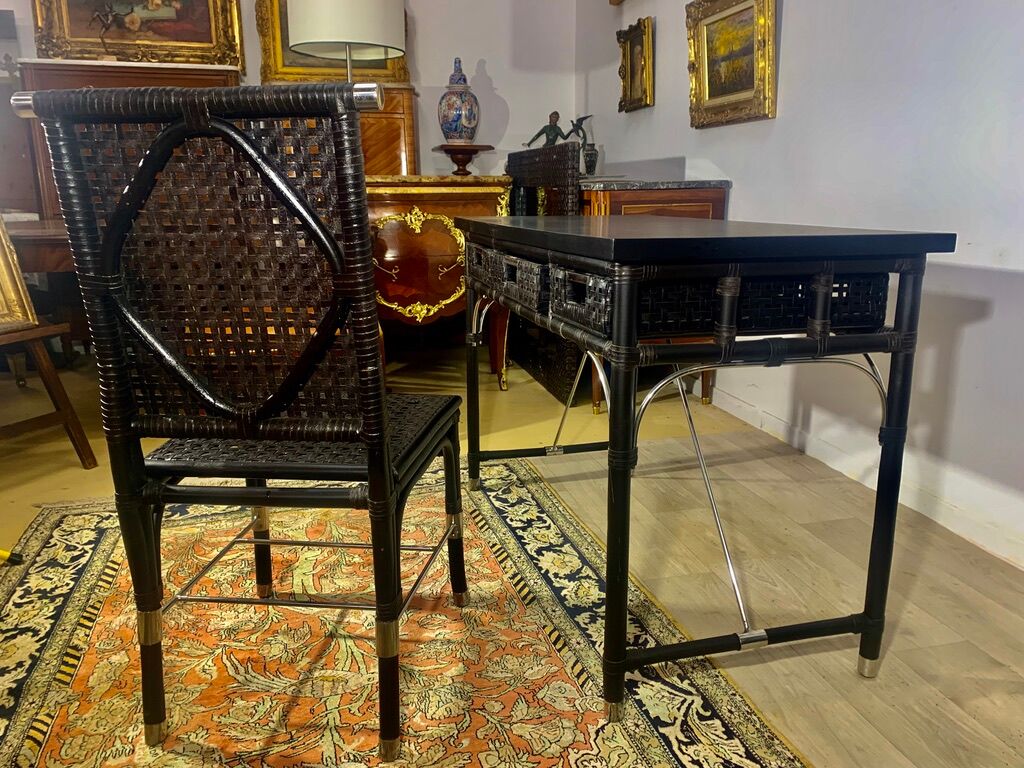 Office with its rattan armchair and brown leather braiding, italian design