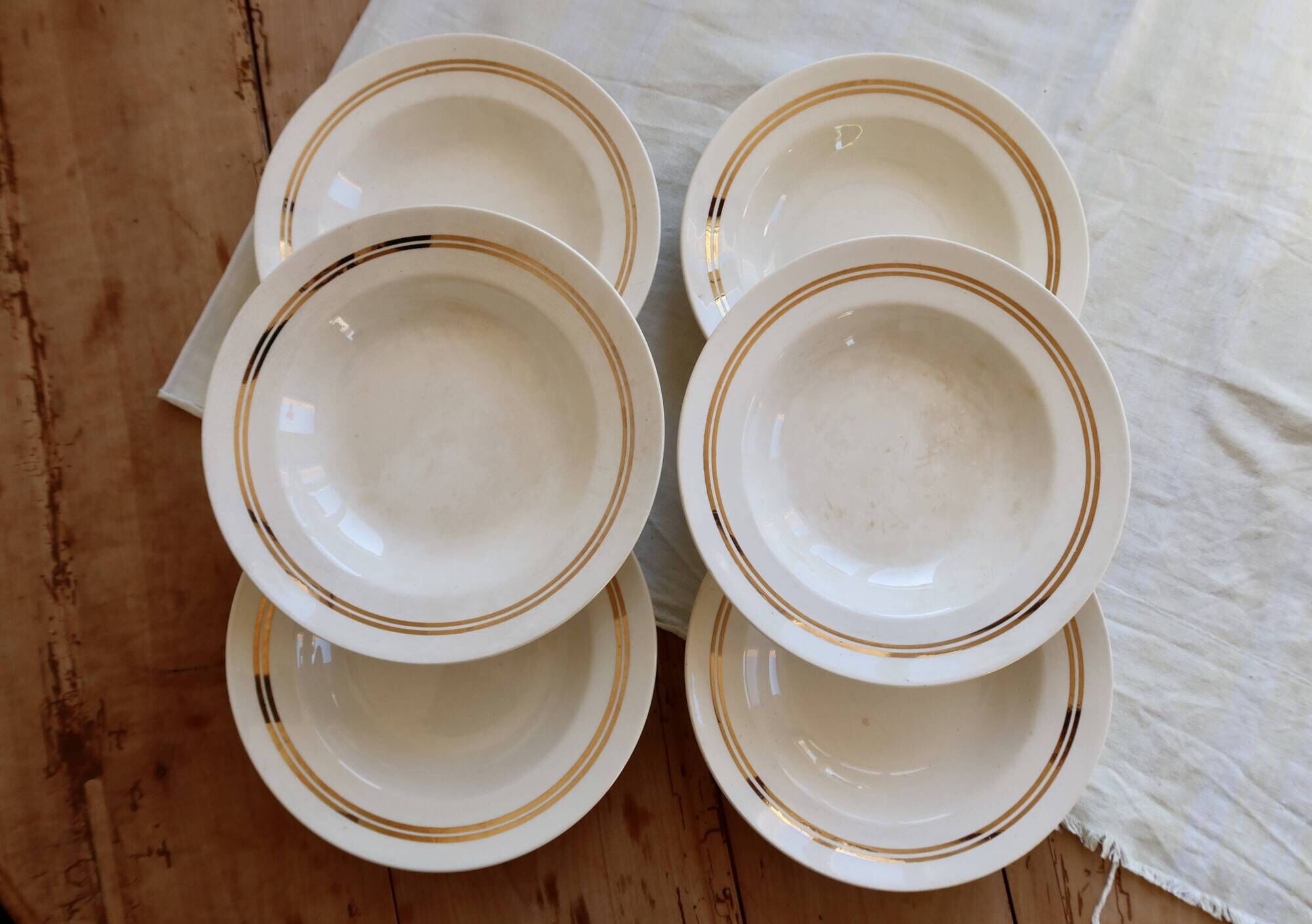 6 vintage ivory earthenware deep plates with double gold trim