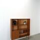 Deens teak vakkenkast met lades en hoge poten, vintage wandkast