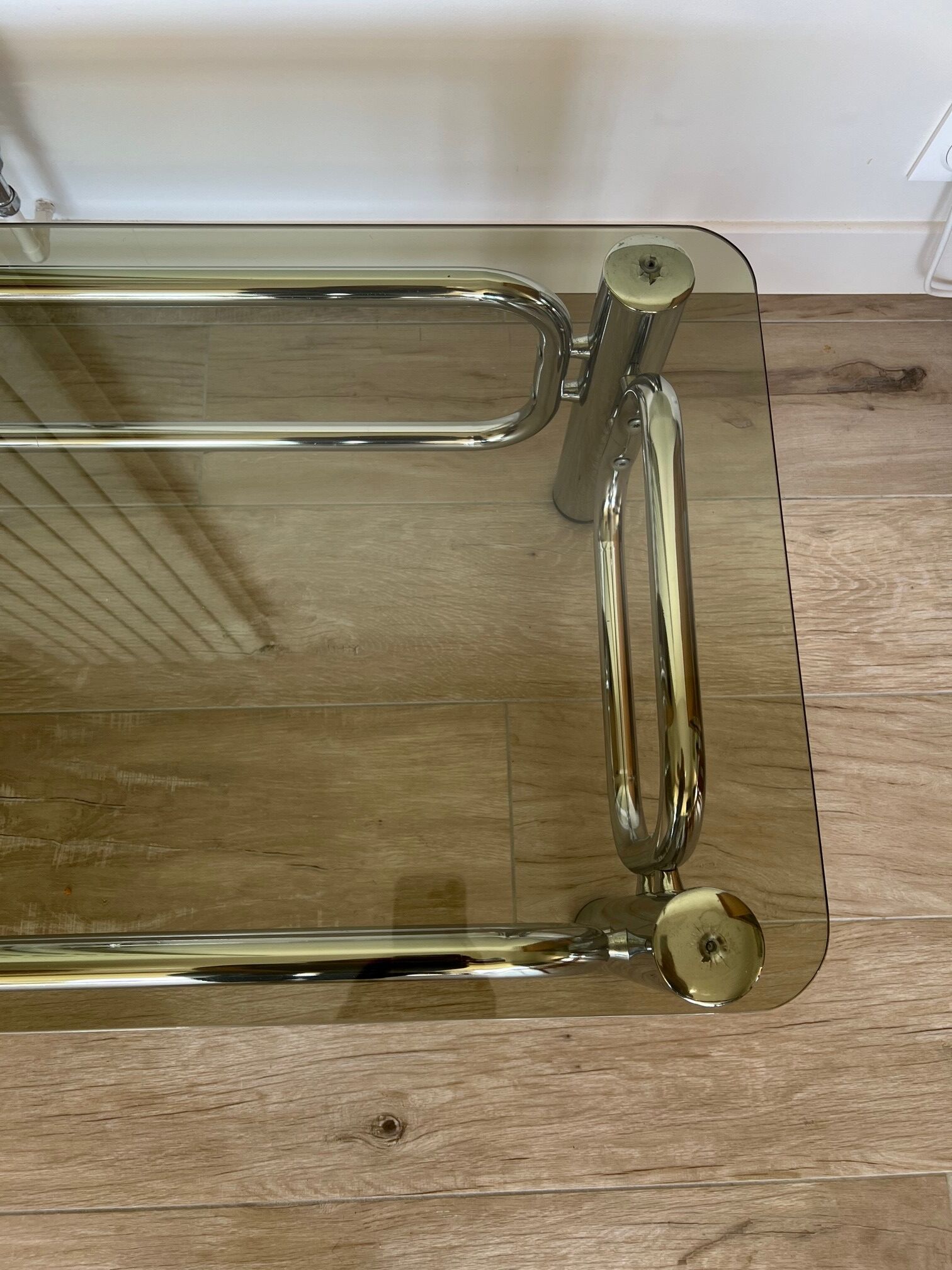 Coffee table in chrome and smoked glass