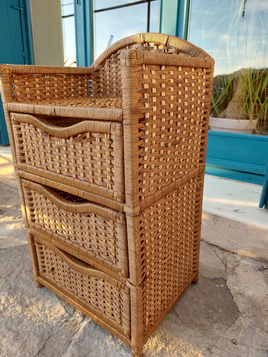 Wicker chest of drawers and rope
