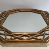 Octagonal mirror in gilded wood with closed guards