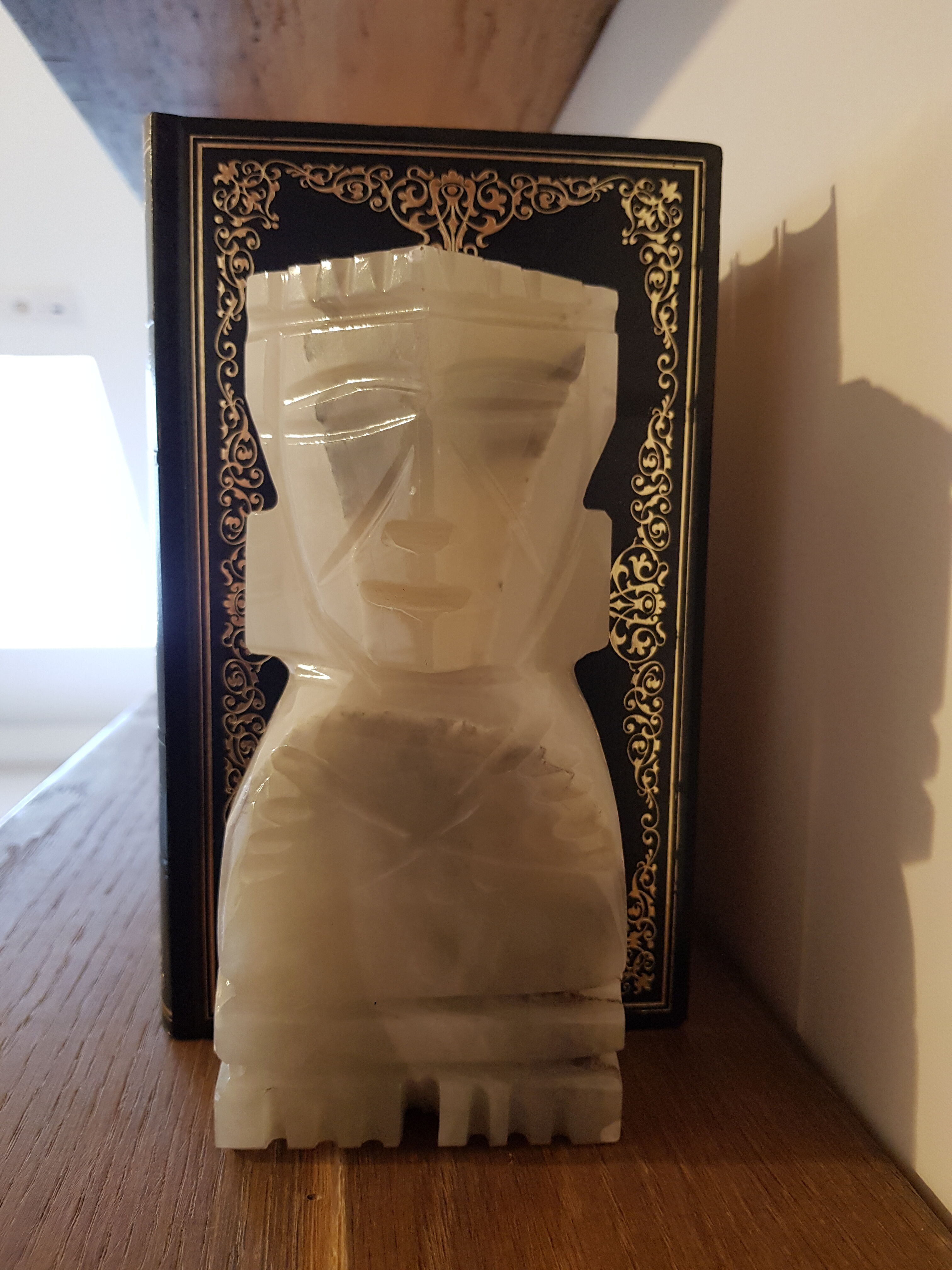Onyx book clambands depicting an Aztec statue
