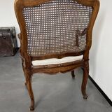 Regency canned armchair in carved walnut