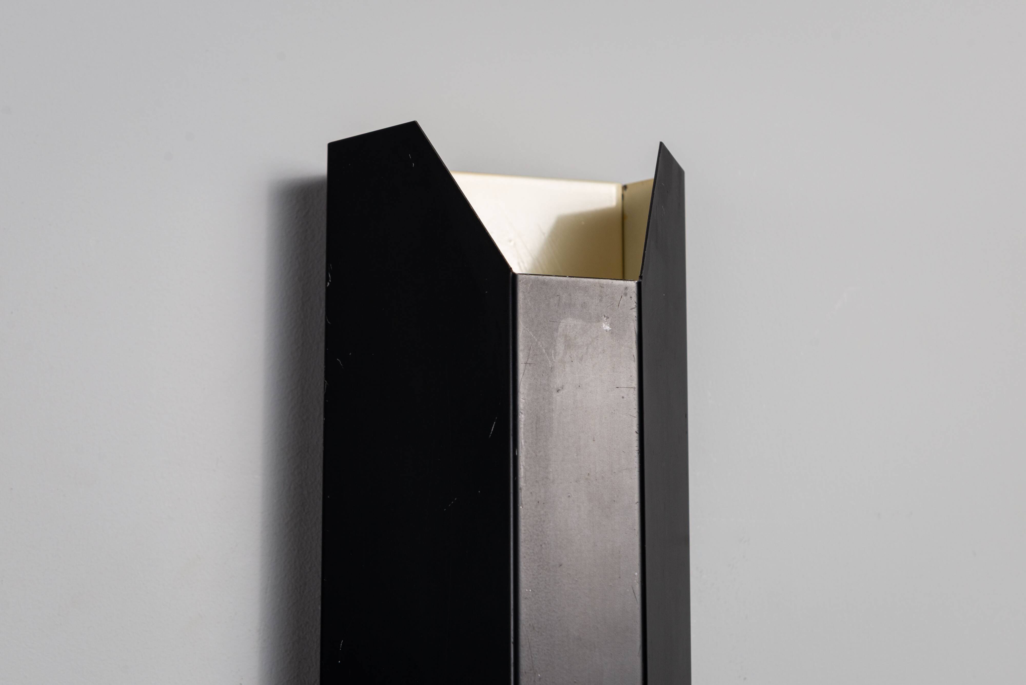 Architectural pair of vintage black metal wall lamps with angular geometric