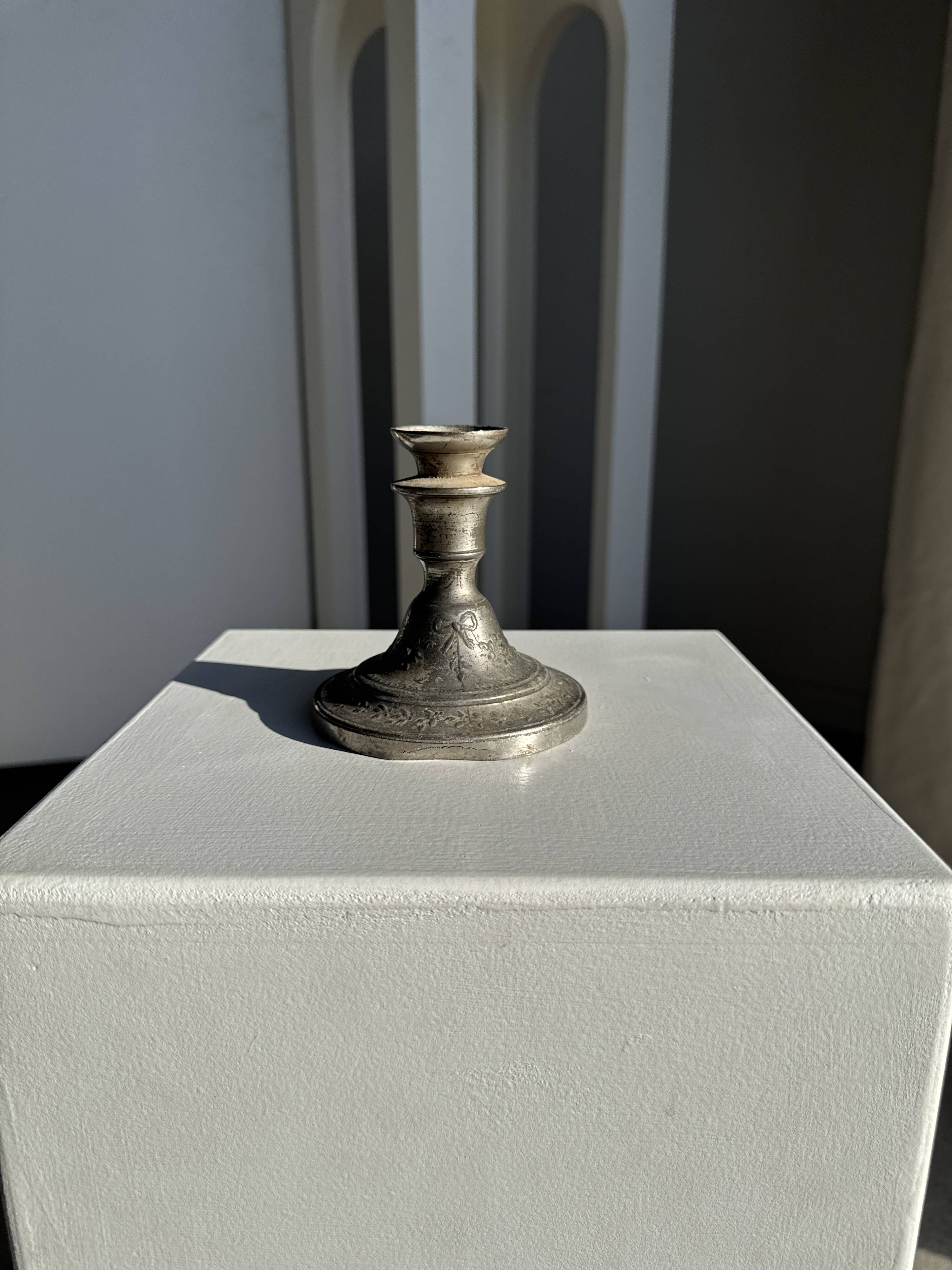 Small antique candle holder engraved in silver-plated metal, in its original condition.