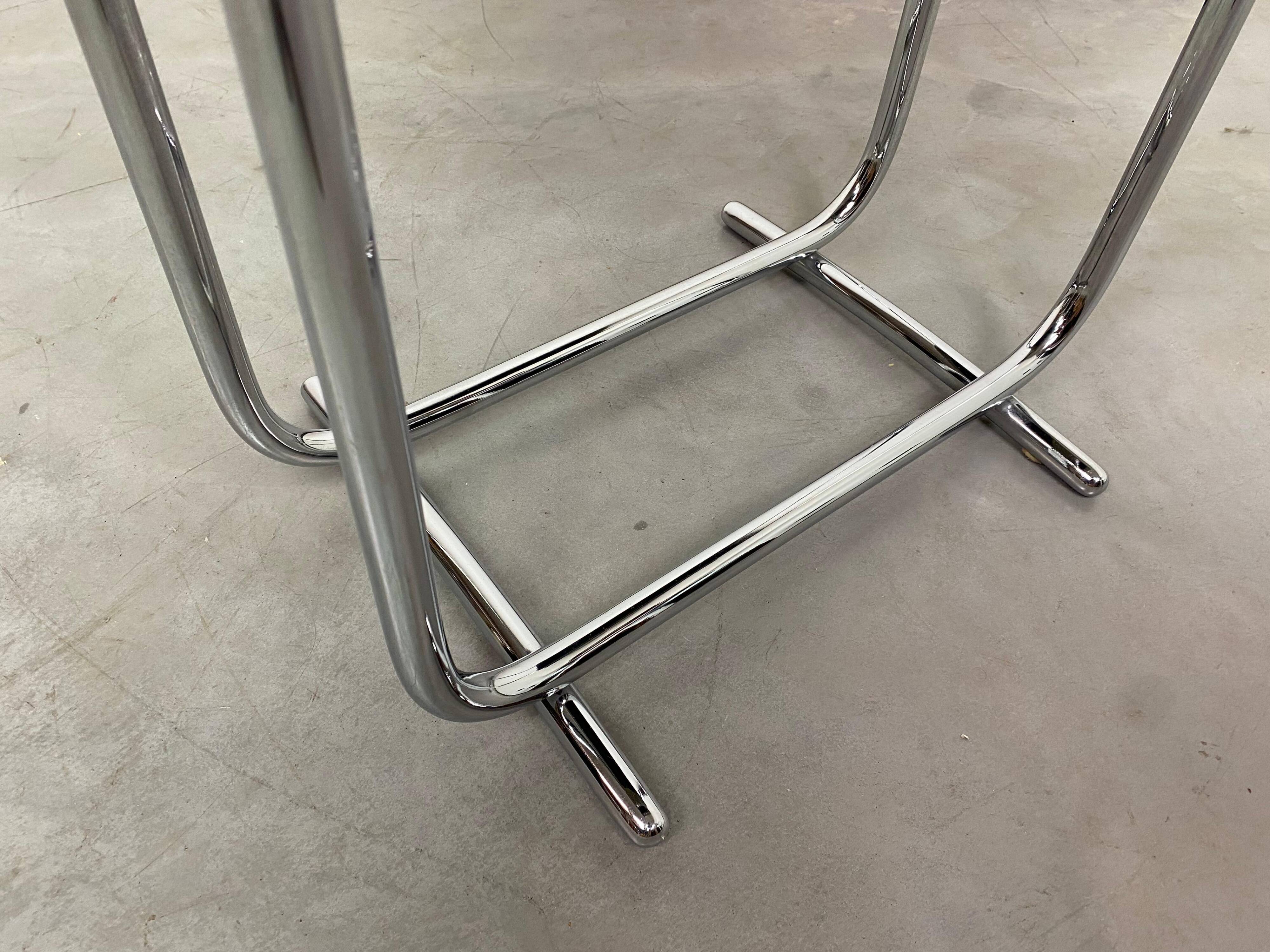 Bauhaus side table with a black glass top