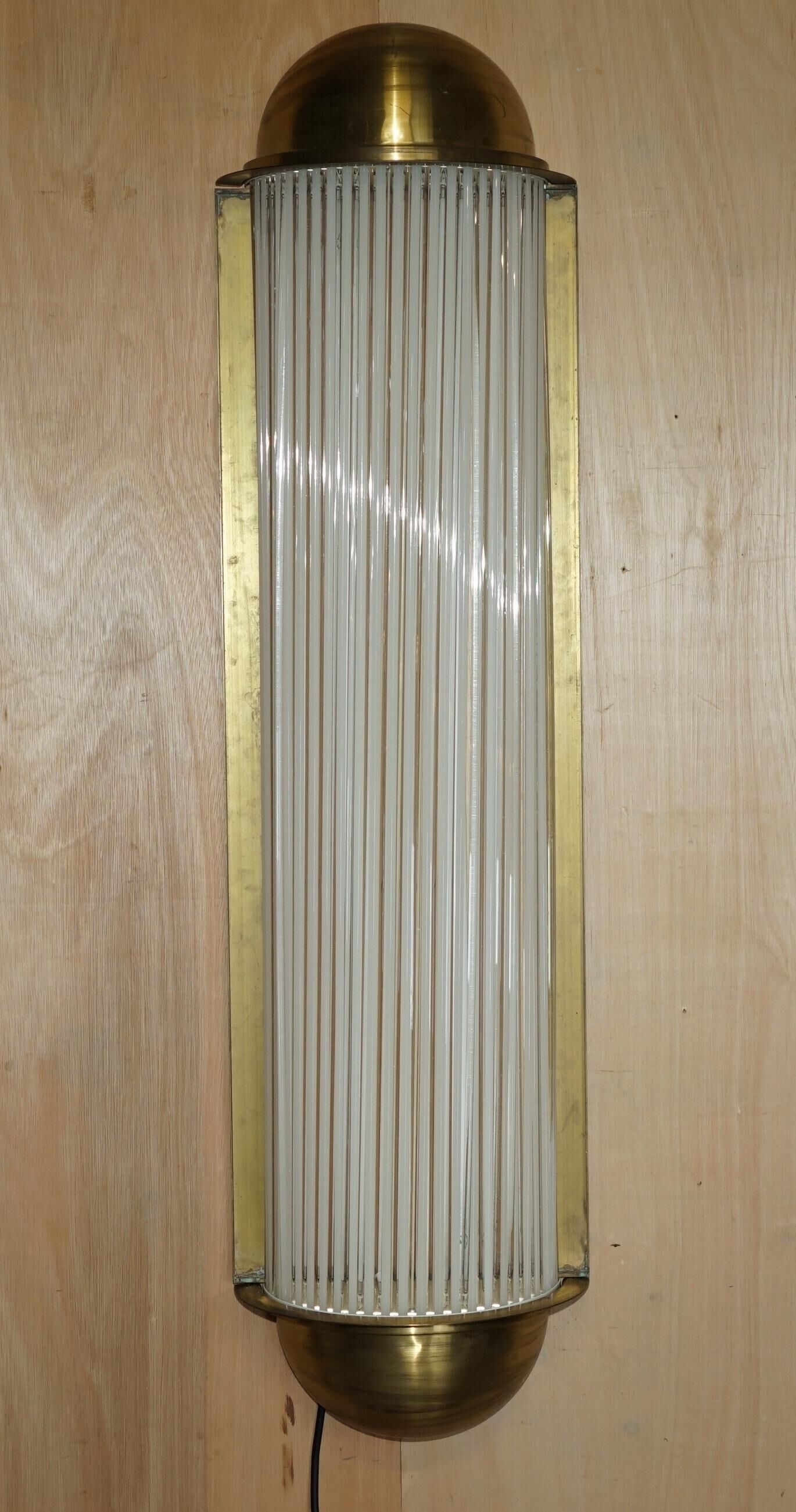 Pair of Art Deco wall sconces in brass and glass by Genet-Michon.