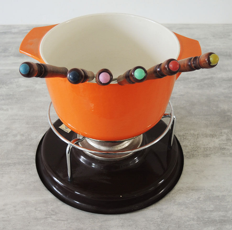 Nomar fondue service in orange cast iron