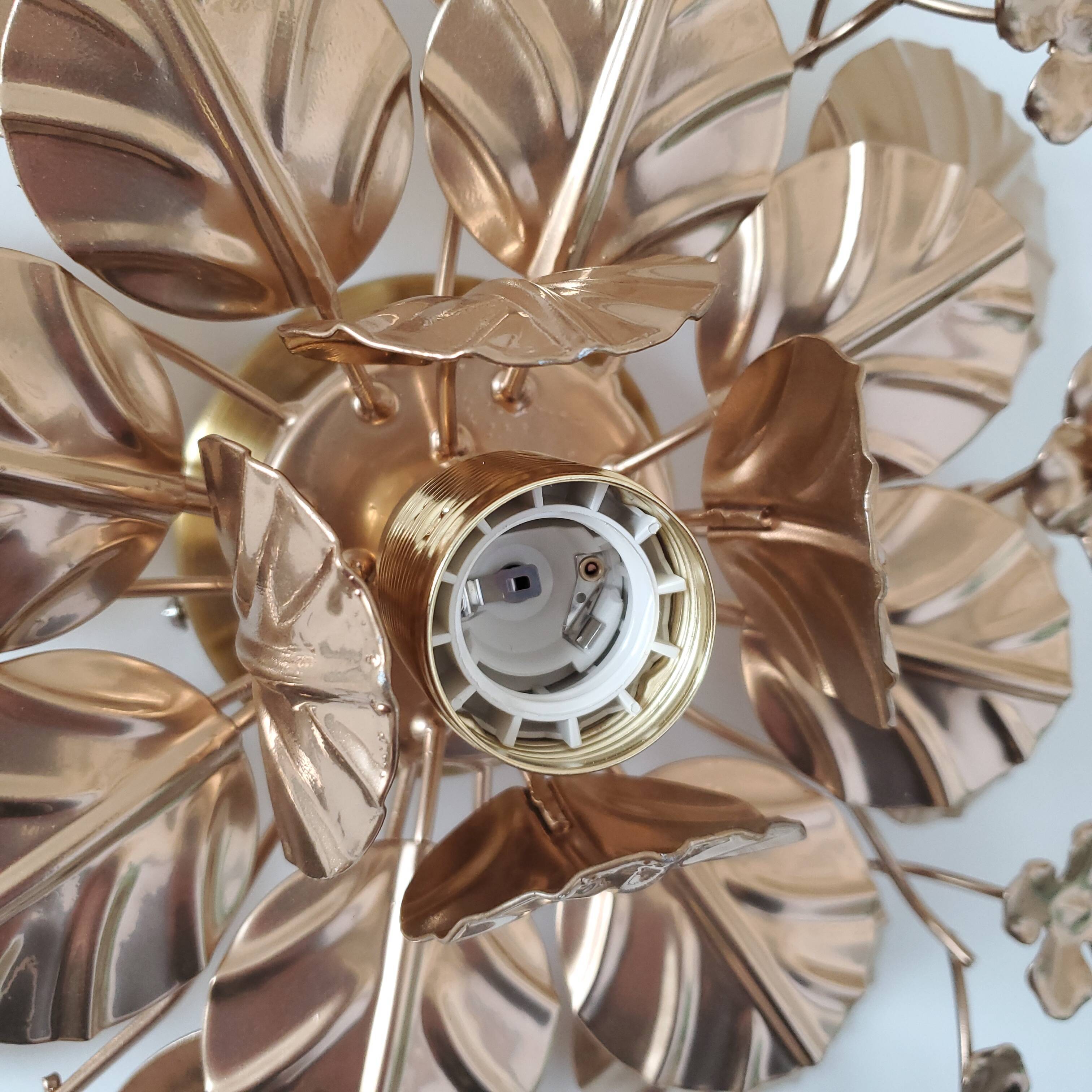Golden metal flower sconces