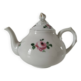 Porcelain teapot with rose patterns