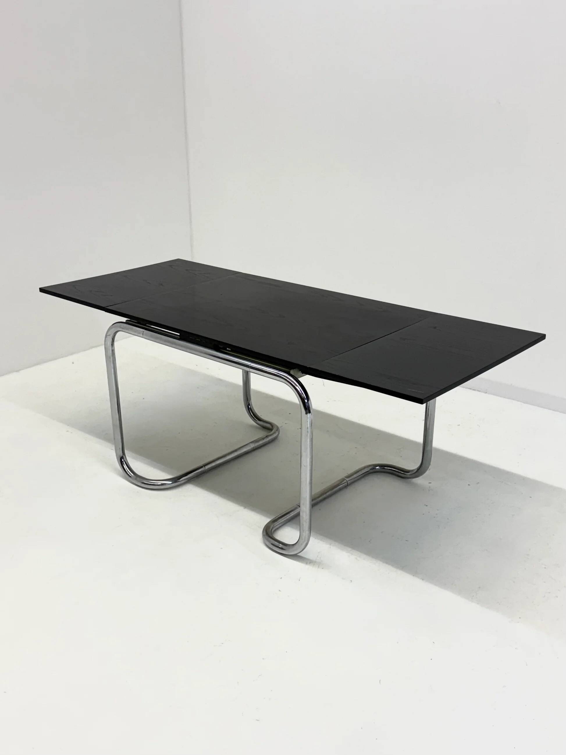 Acerbis dining table with black oak top by Giotto Stoppino