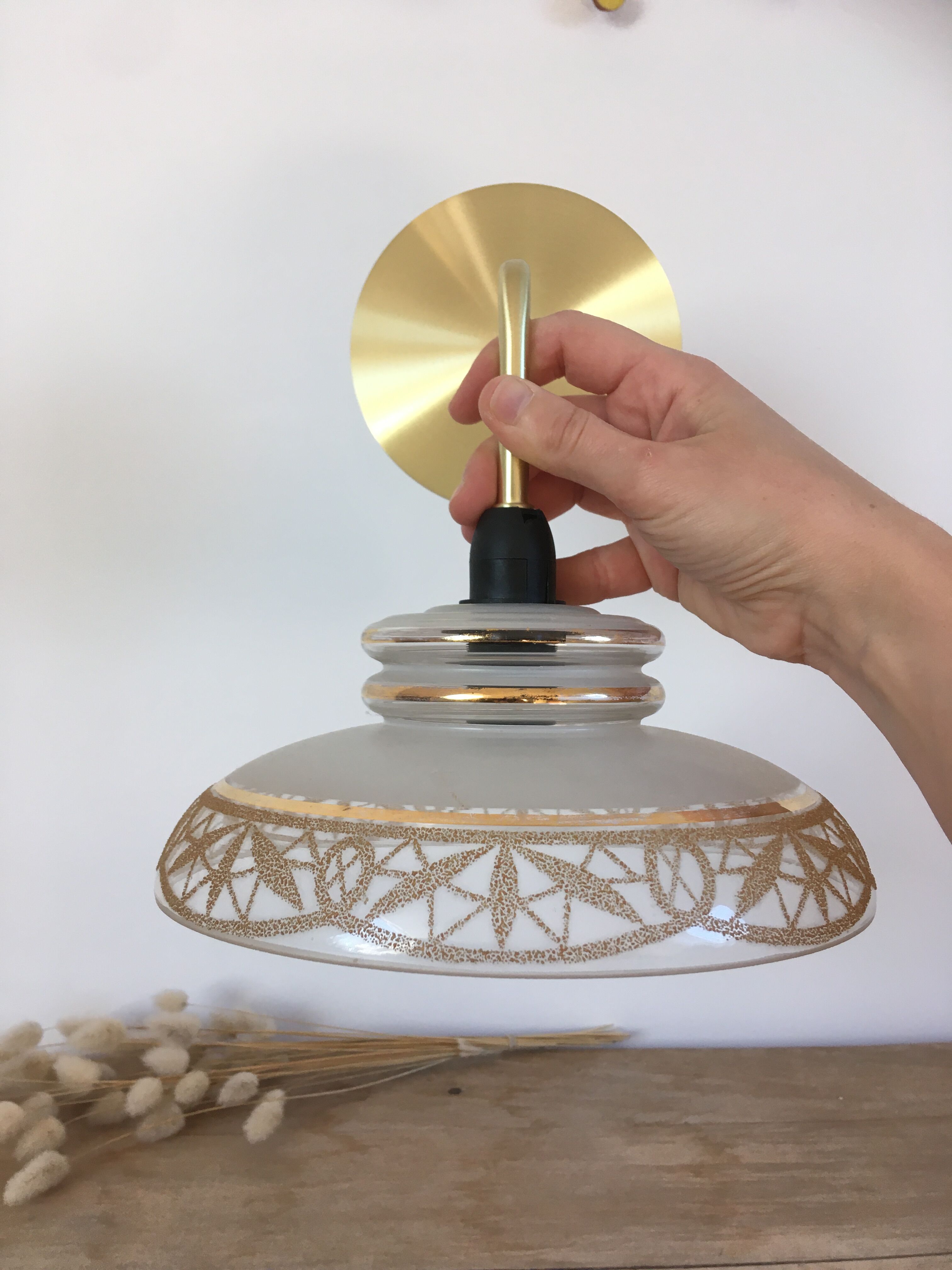 Vintage globe wall lamp in glass and brass base