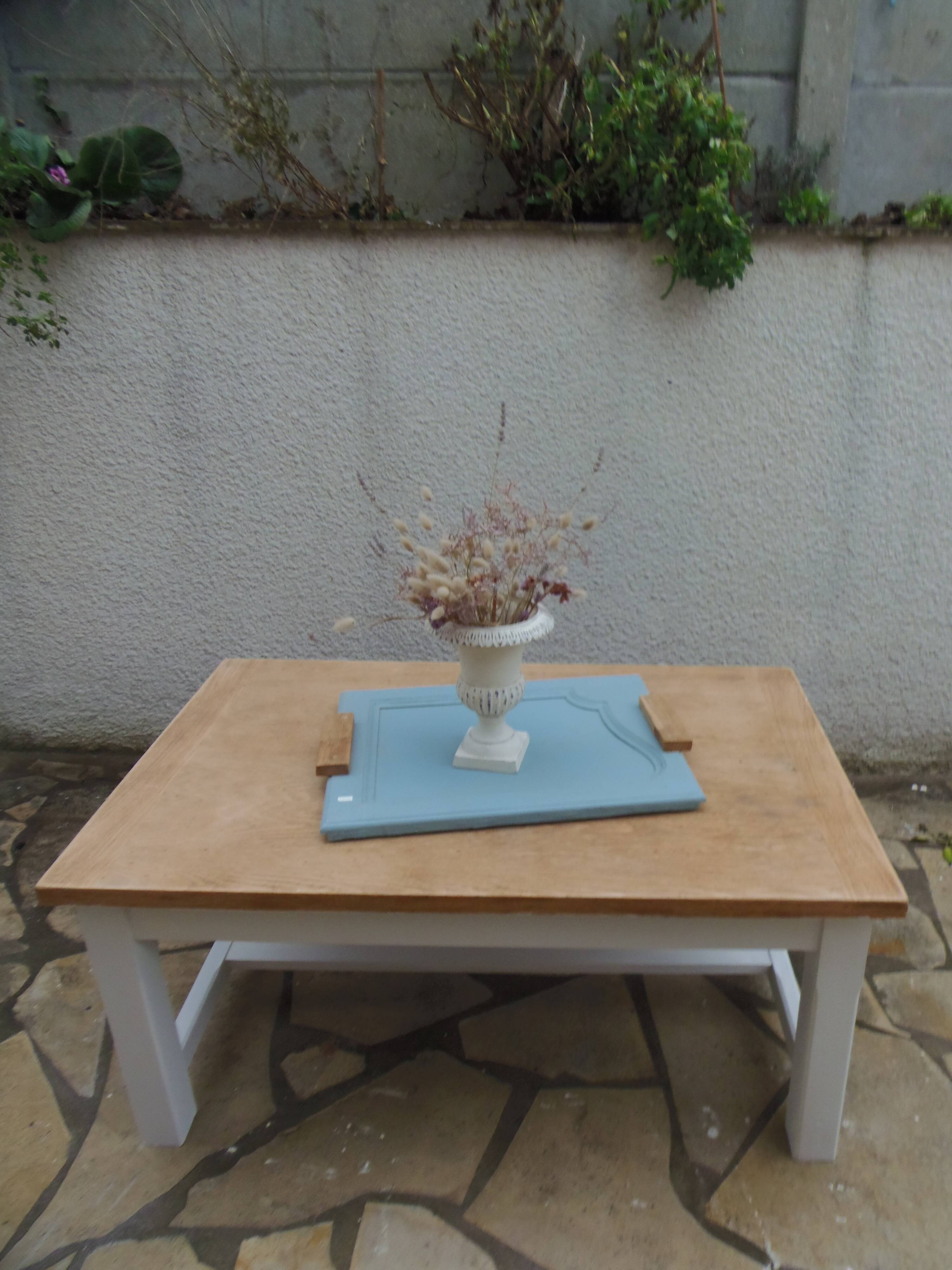Coffee table with pearl grey legs and a wooden top.